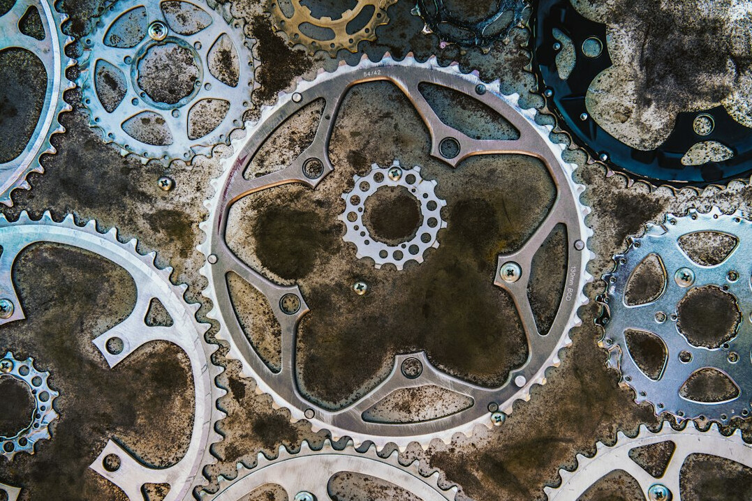 Abstract gears overlaid on a digital circuit board